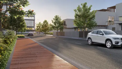 Trident Parktown Panipat internal road with landscaped pedestrian walkway and residences